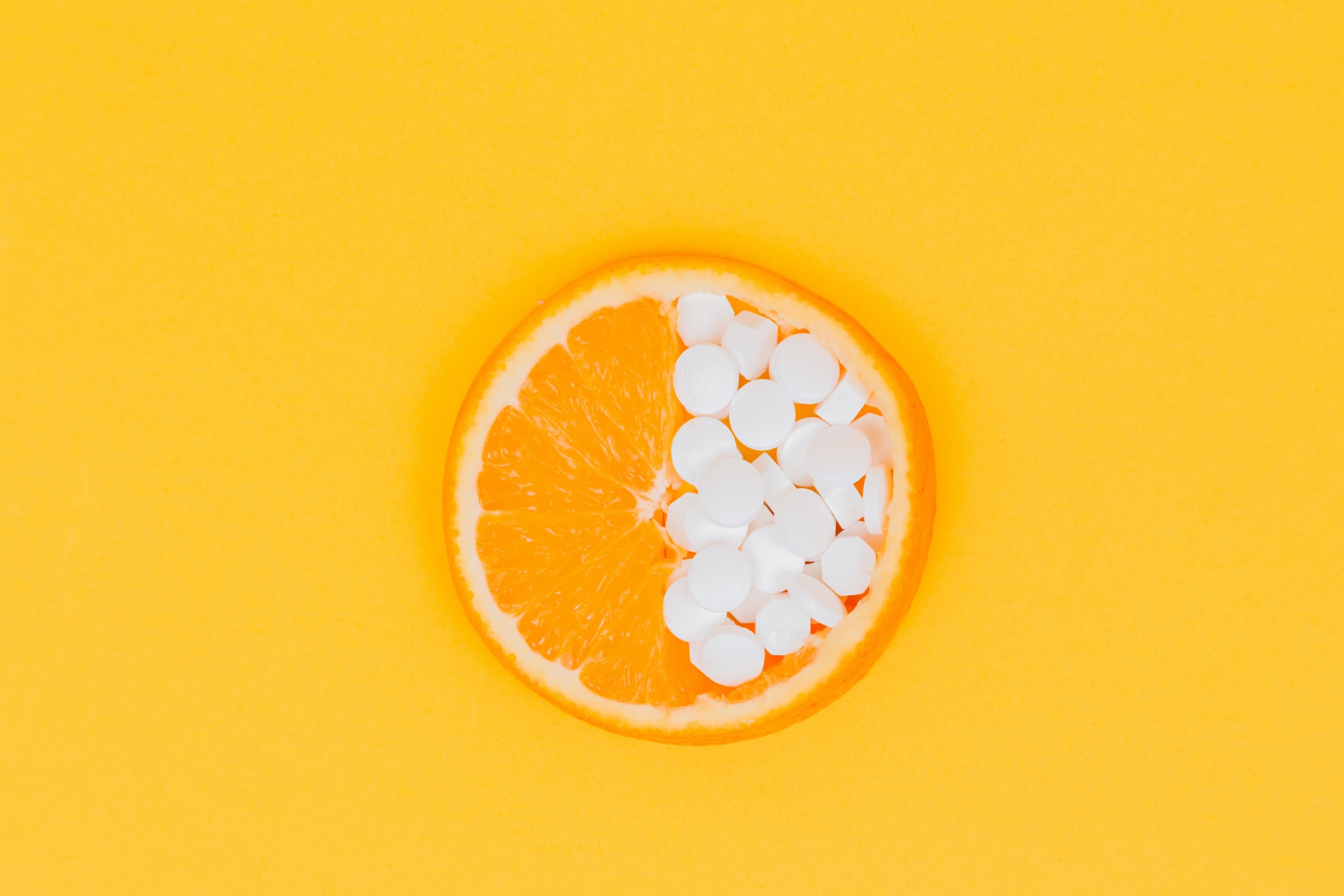 Vitamin pills and orange