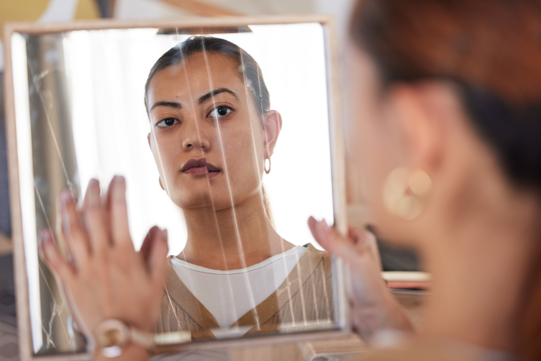 a woman looking at herself