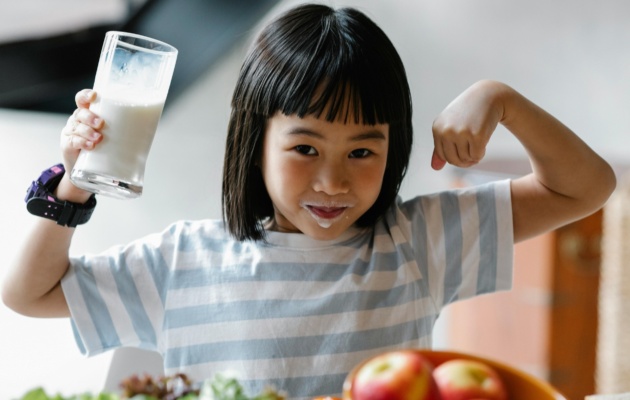 Girl Drinking Milk for Calcium