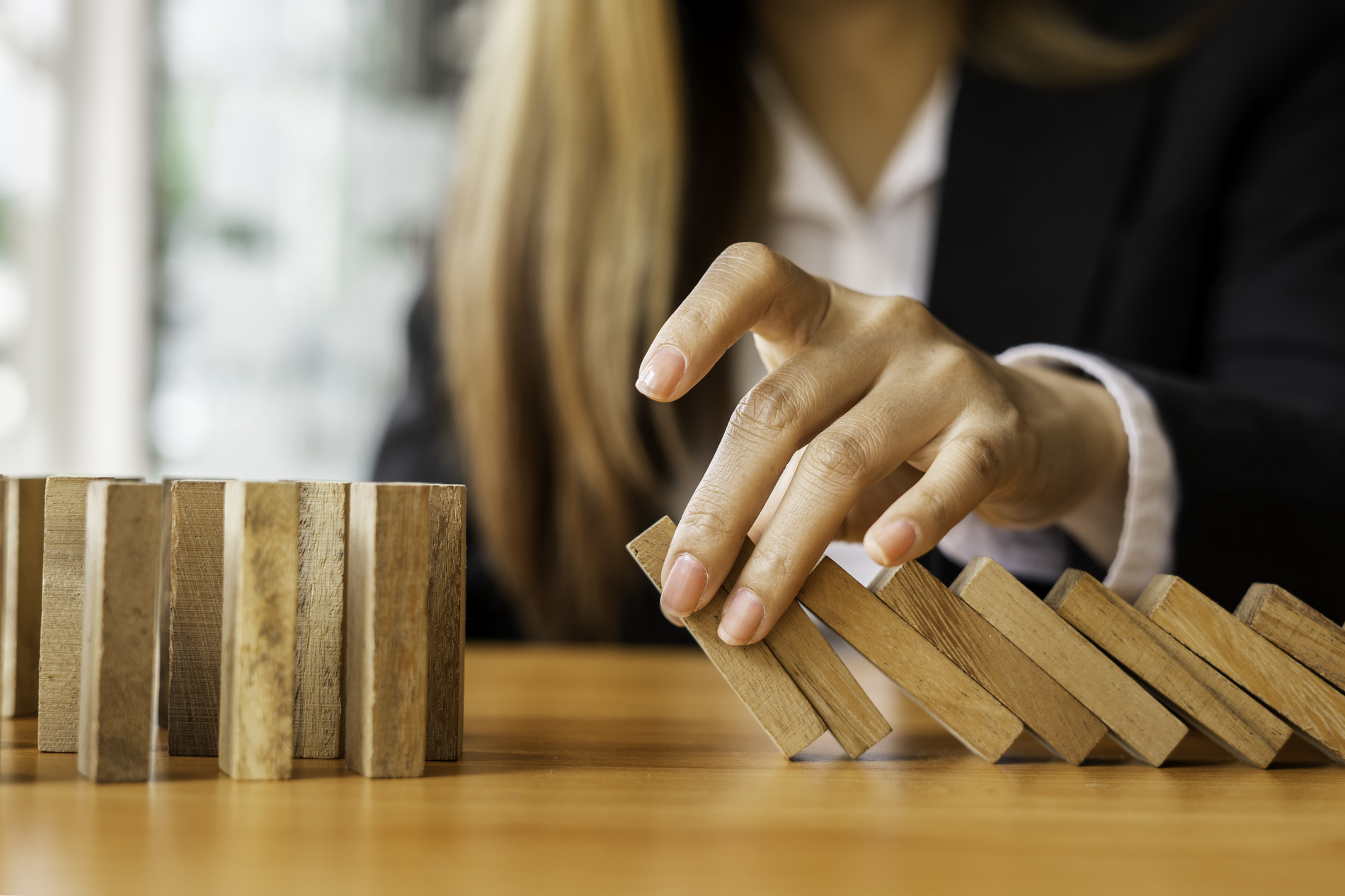 person holding wooden blocks