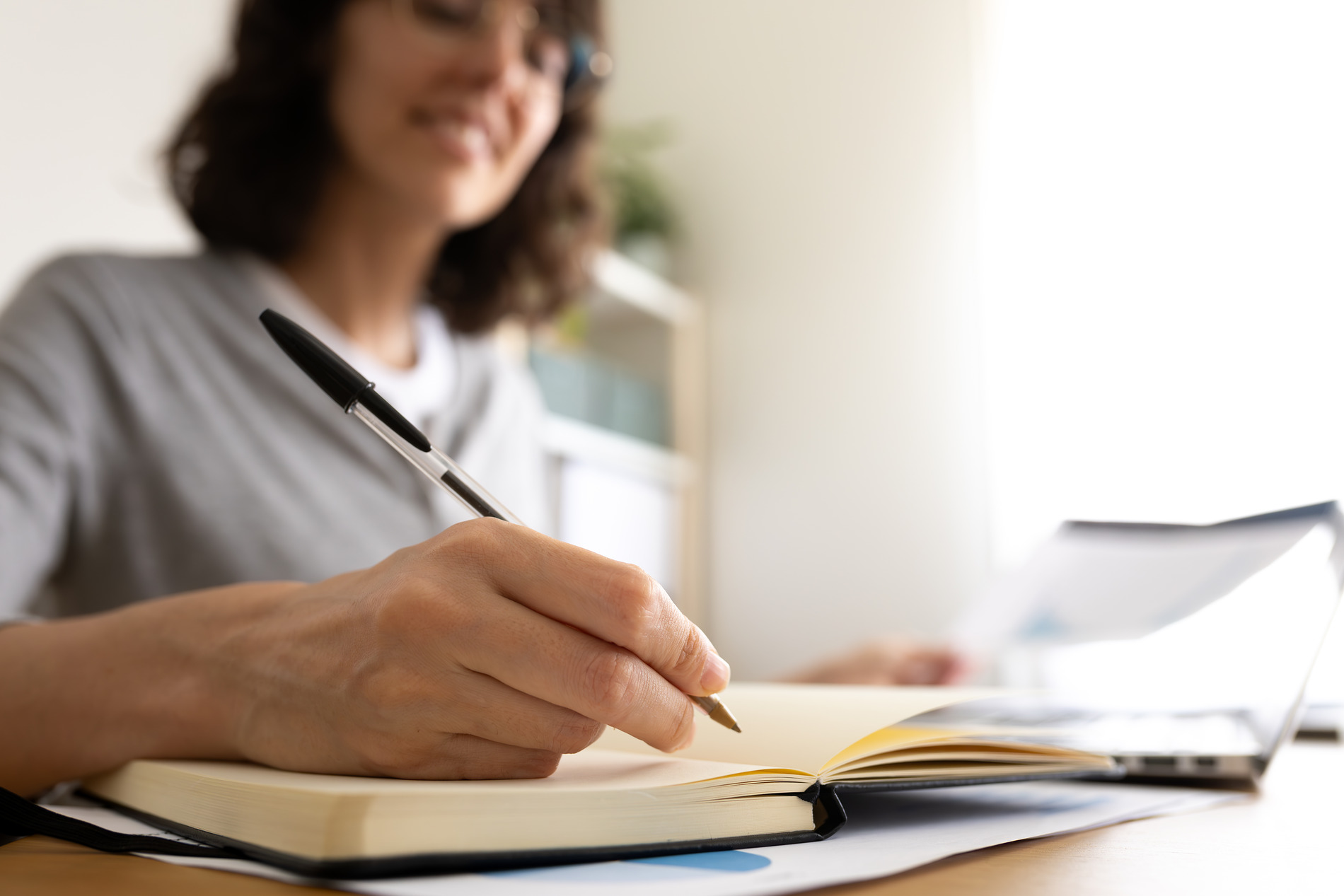 person writing a journal