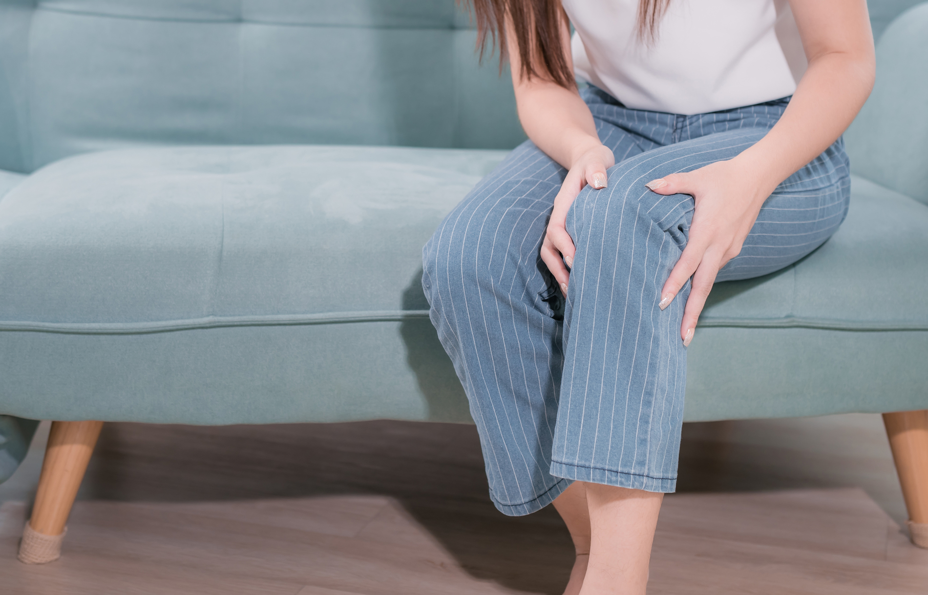 person holding their leg