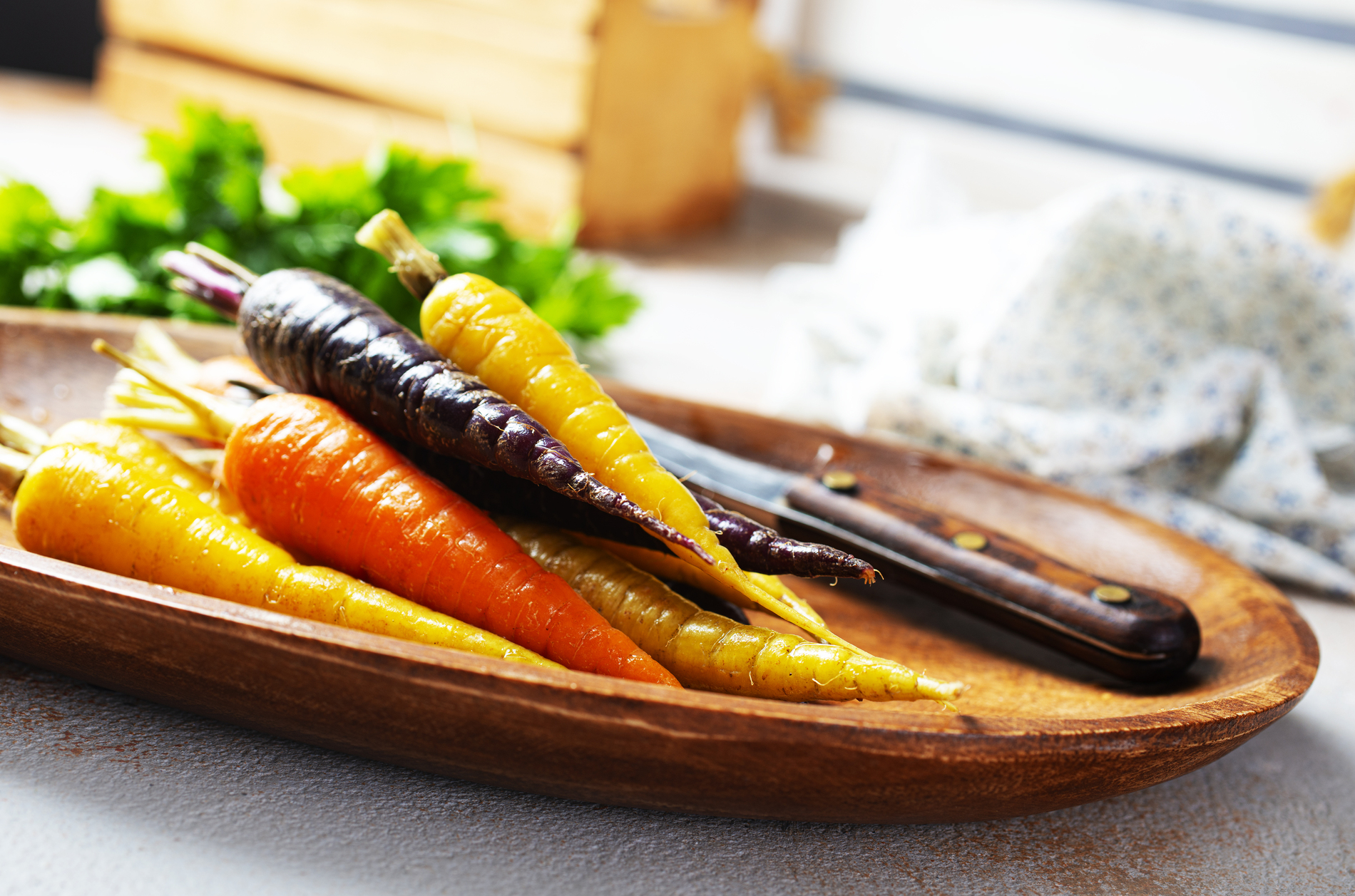 Colorful carrots on gray background