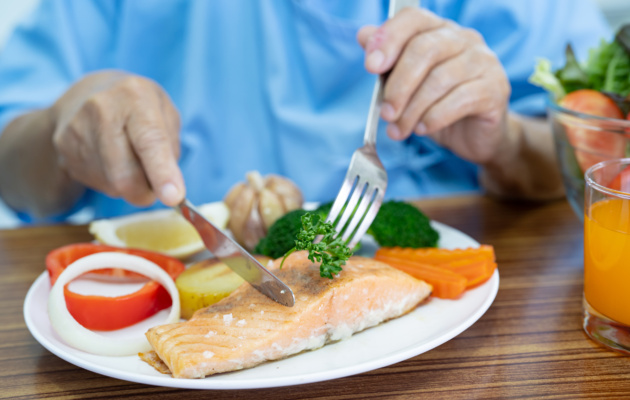 person eating fish