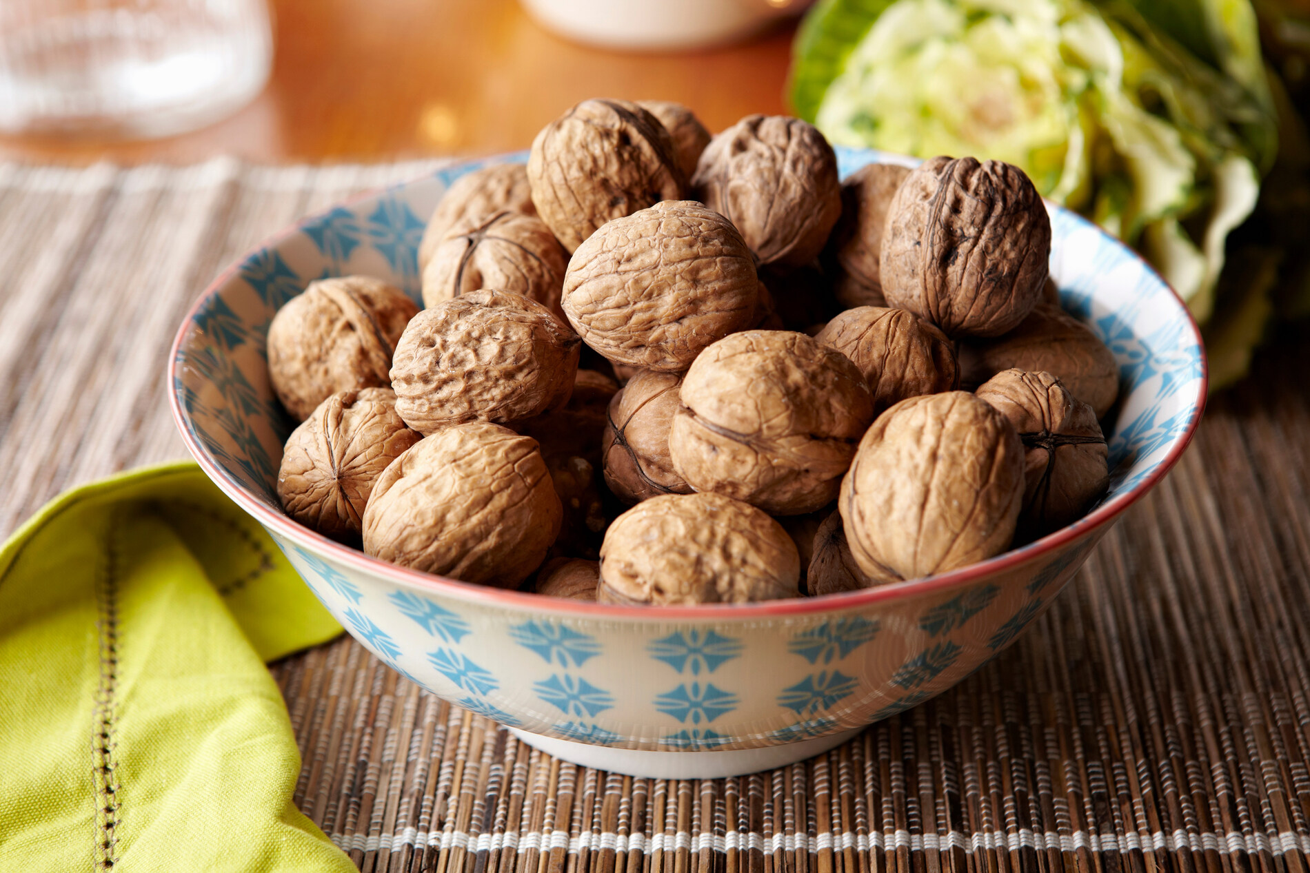Bowl of walnuts on table