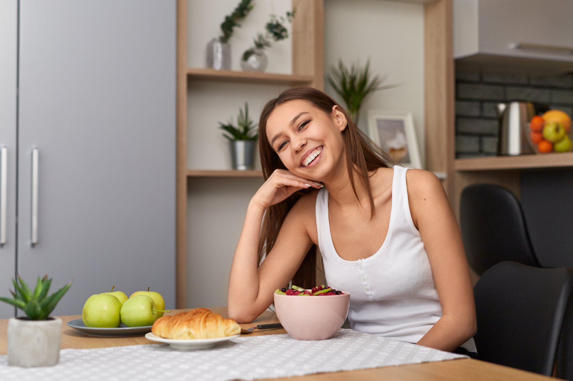 woman smiling at breakfast