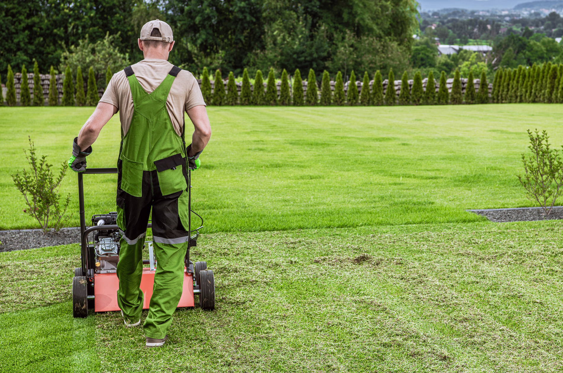 Person mowing lawn