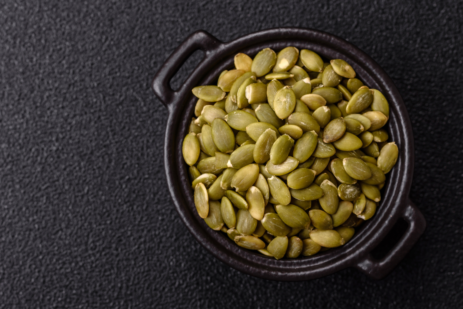 Peeled pumpkin seeds in a bowl