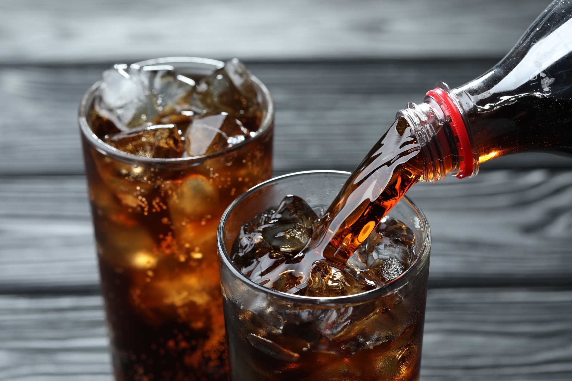 Pouring cola into glass