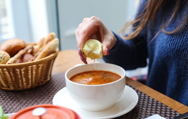person eating soup