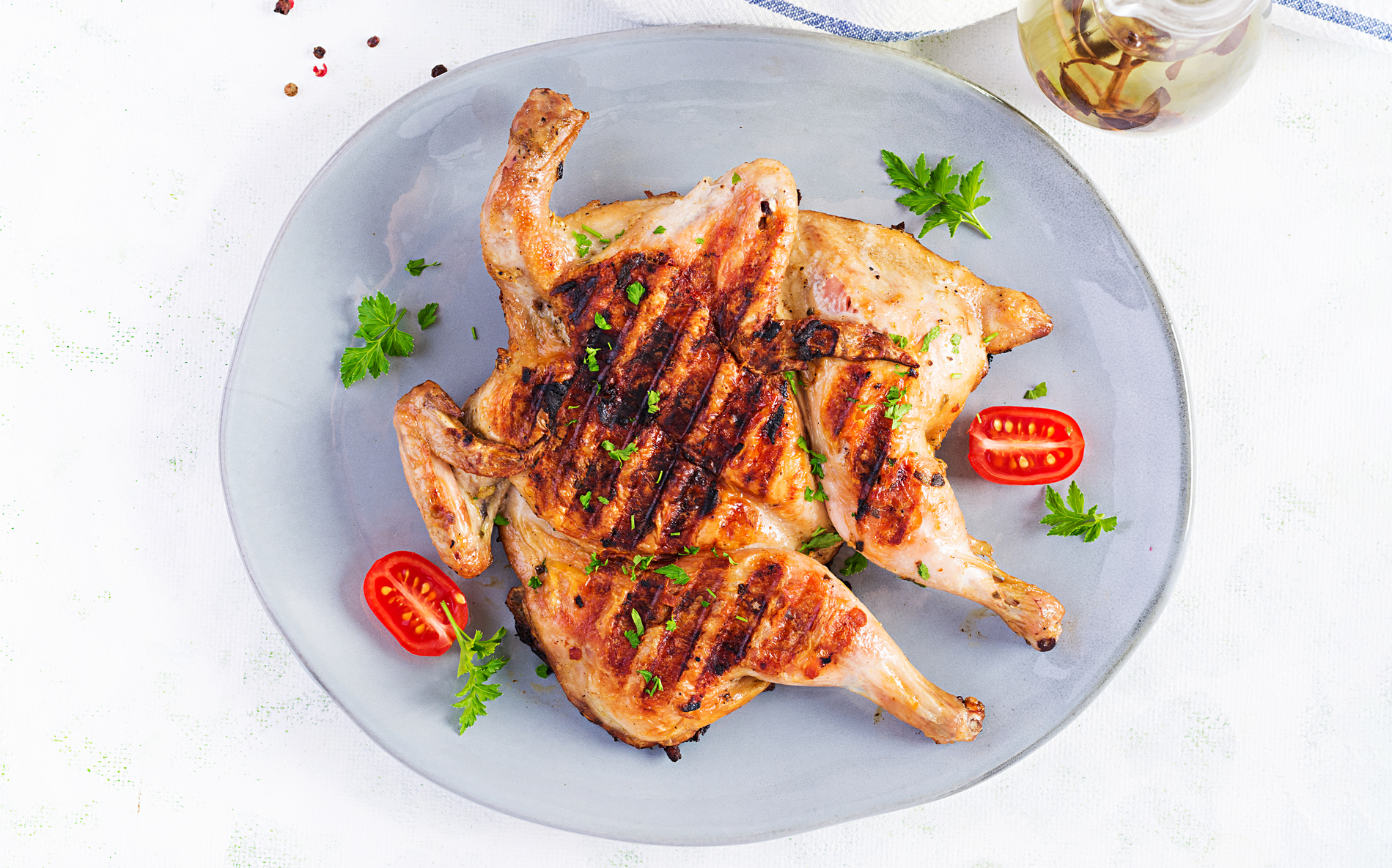 Grilled chicken on blue plate