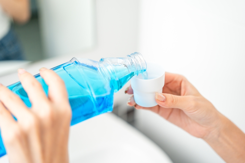 Rinse with Antimicrobial Mouthwash